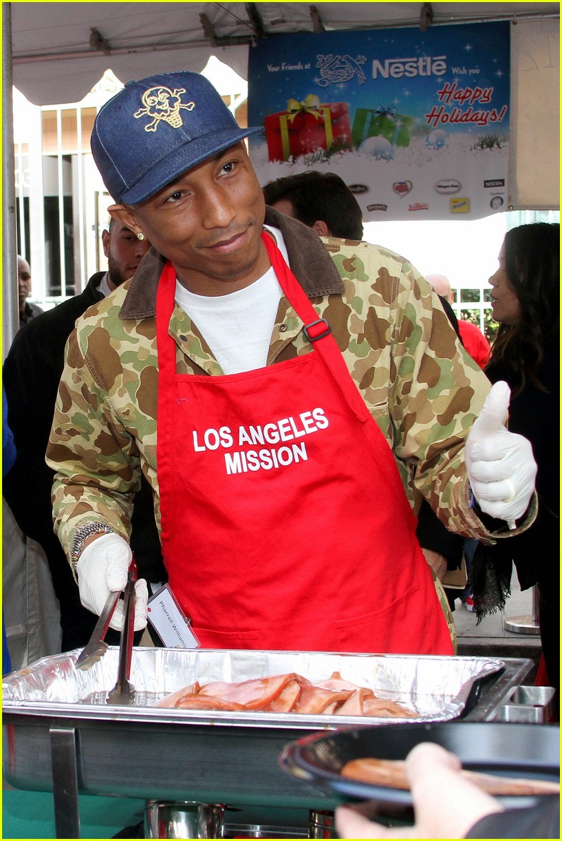 Emmy Rossum & Pharrell Williams Feed Homeless on Christmas Eve Photo