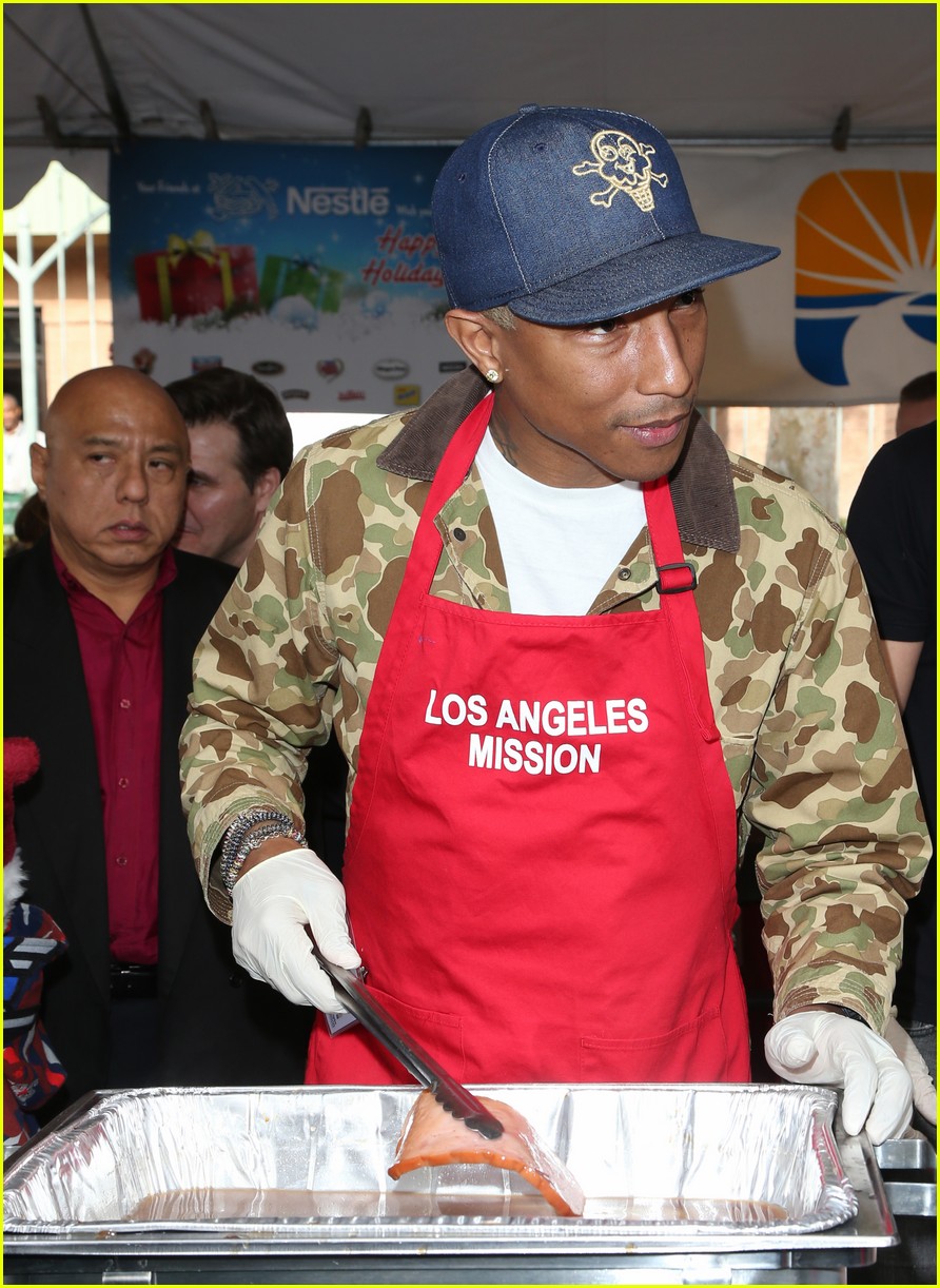 Emmy Rossum & Pharrell Williams Feed Homeless on Christmas Eve Photo