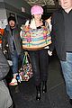 miley cyrus wears ring at airport 01