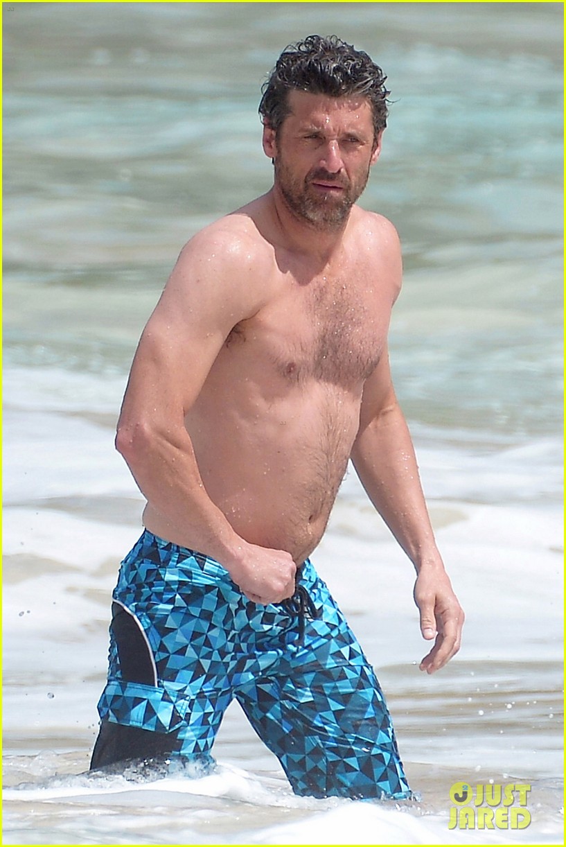 Patrick Dempsey splashes around in the water while showing off his shirtles...