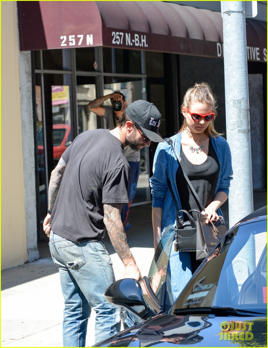 Behati Prinsloo Shows Off Tiny Baby Bump with Adam Levine Photo