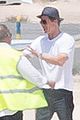 brad pitt waves goodbye before hopping on a private plane 04