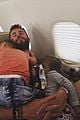 chris hemsworth holds his kids while they nap in his arms 01