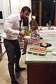 chris hemsworth holds his kids while they nap in his arms 02