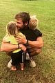 chris hemsworth holds his kids while they nap in his arms 03