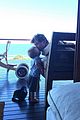 chris hemsworth holds his kids while they nap in his arms 05