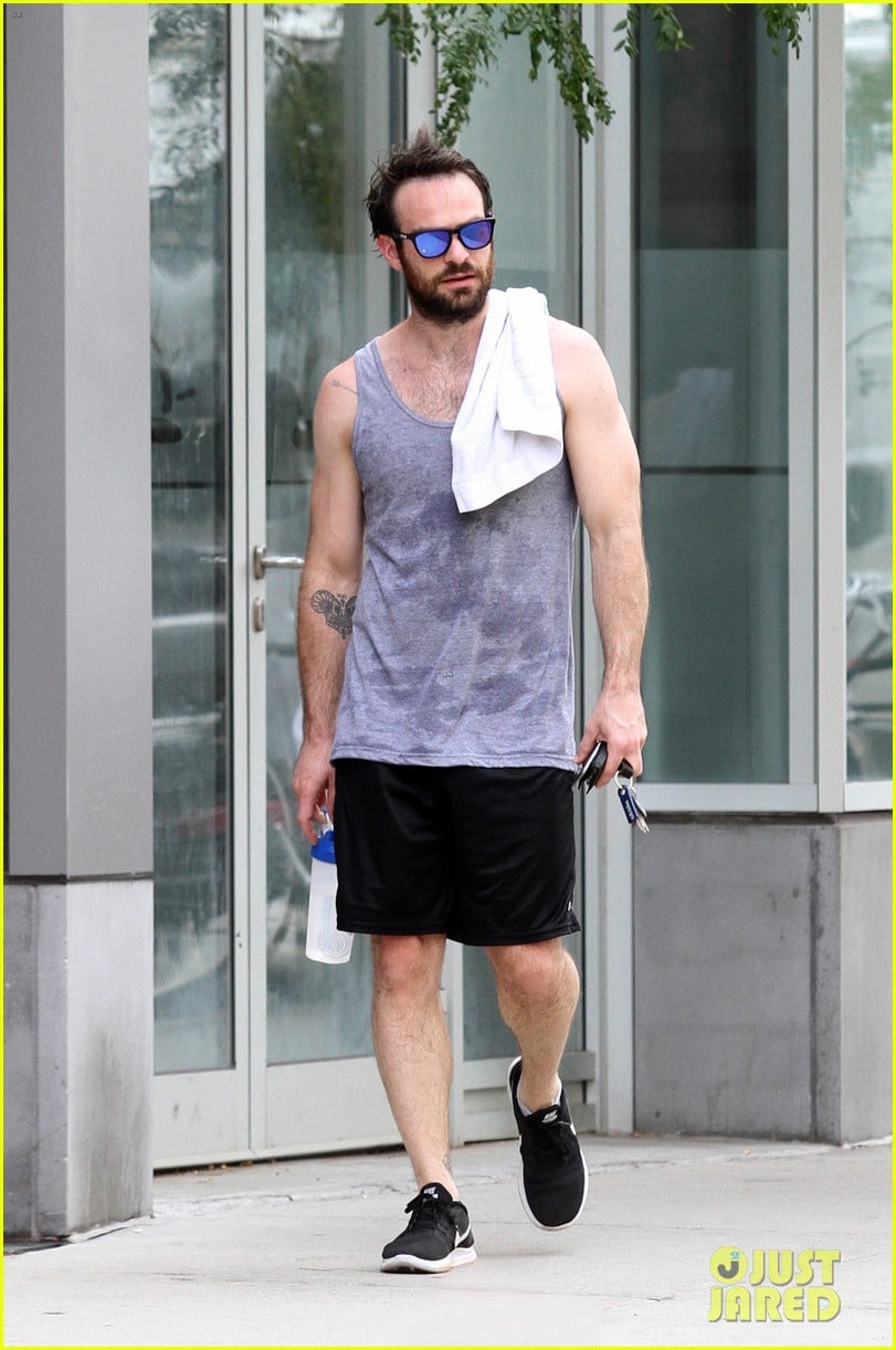 Charlie Cox rocks a gray tank while heading home after a workout at the gym...
