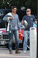 gerard butler carries towel malibu 15
