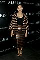 pregnant marion cotillard accentuates baby bump at allied screening 01