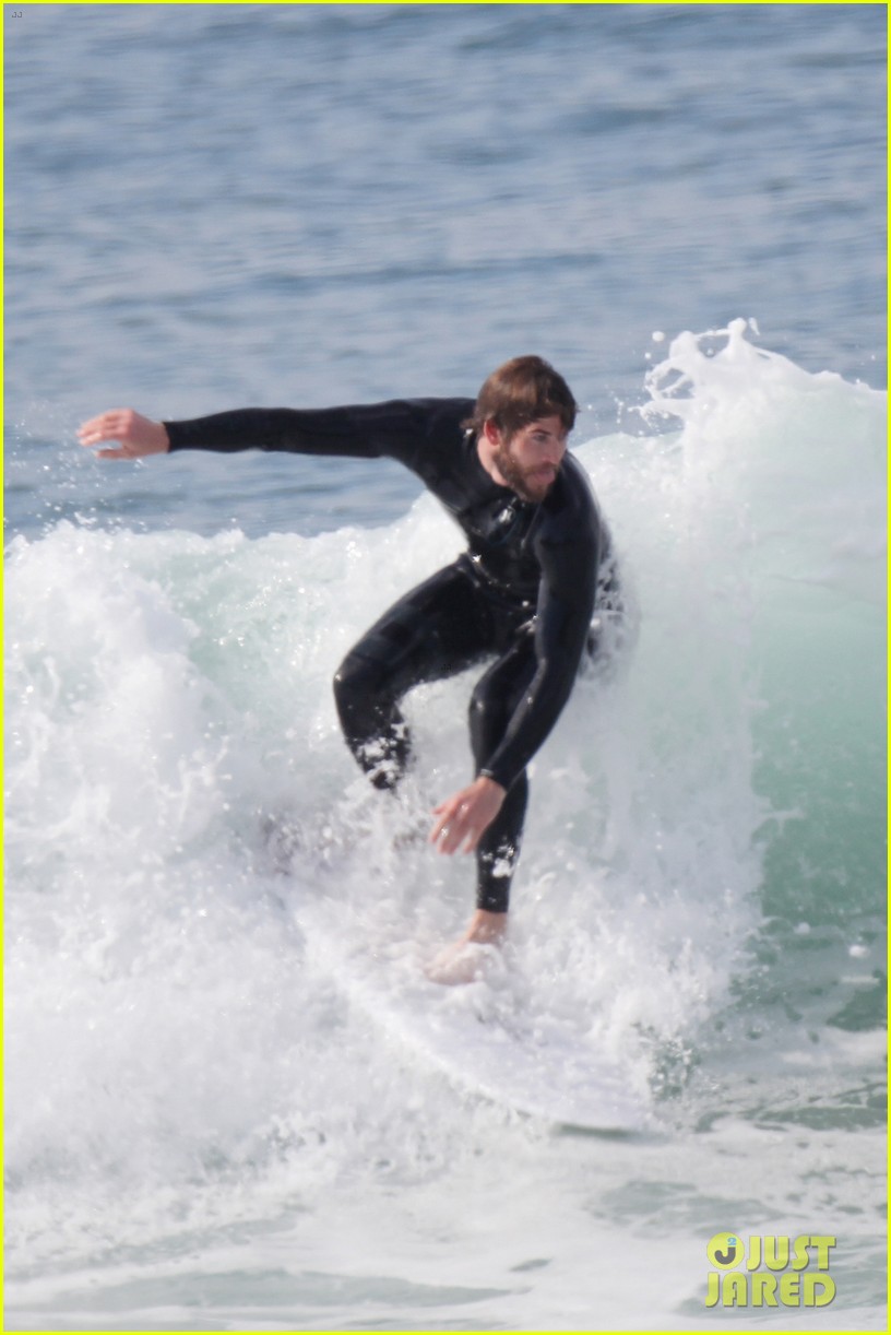 Liam Hemsworth Flaunts His Toned Wetsuit Bod While Surfing See His