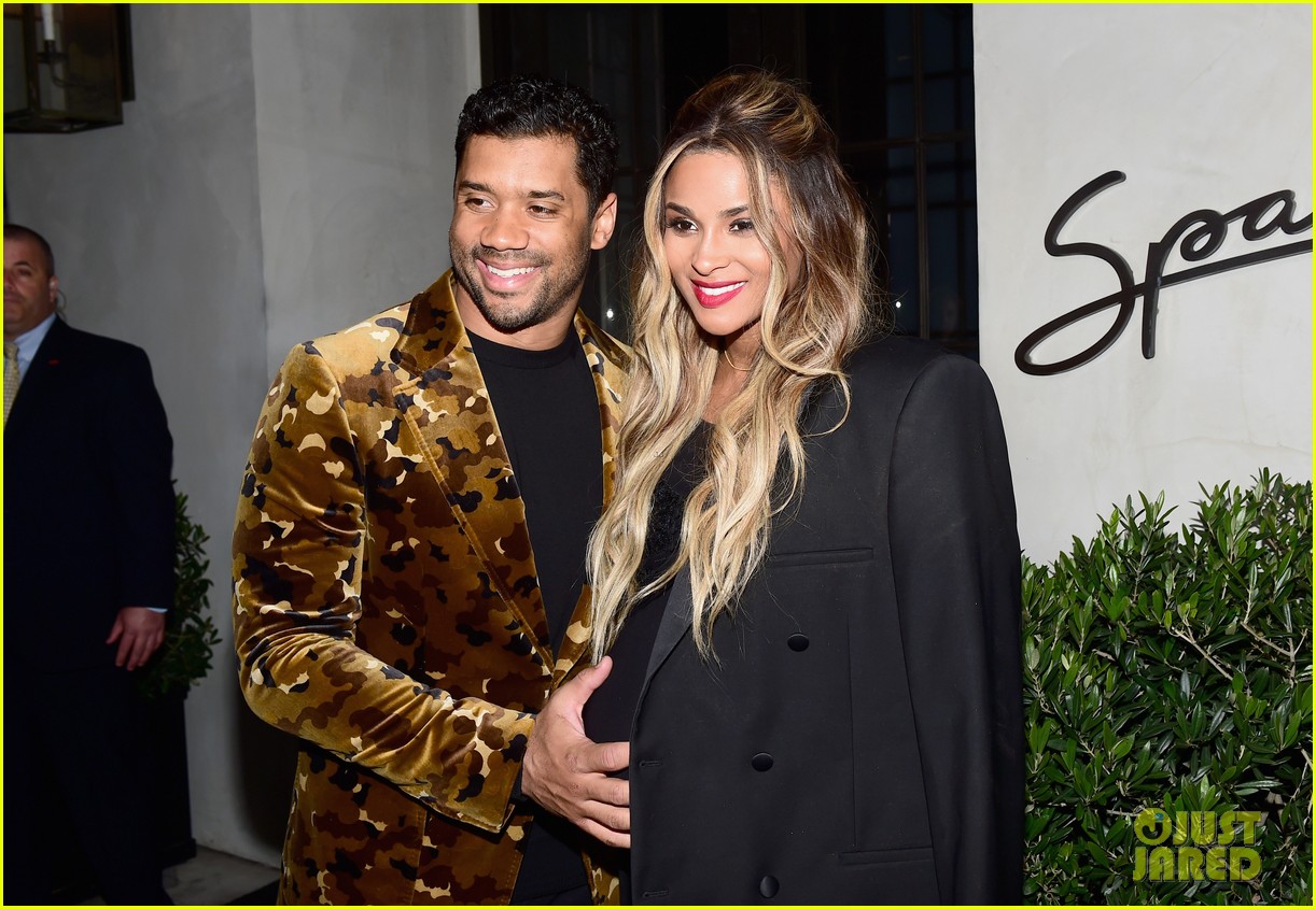 Russell Wilson Holds Pregnant Ciara's Baby Bump at Oscars Party! Photo