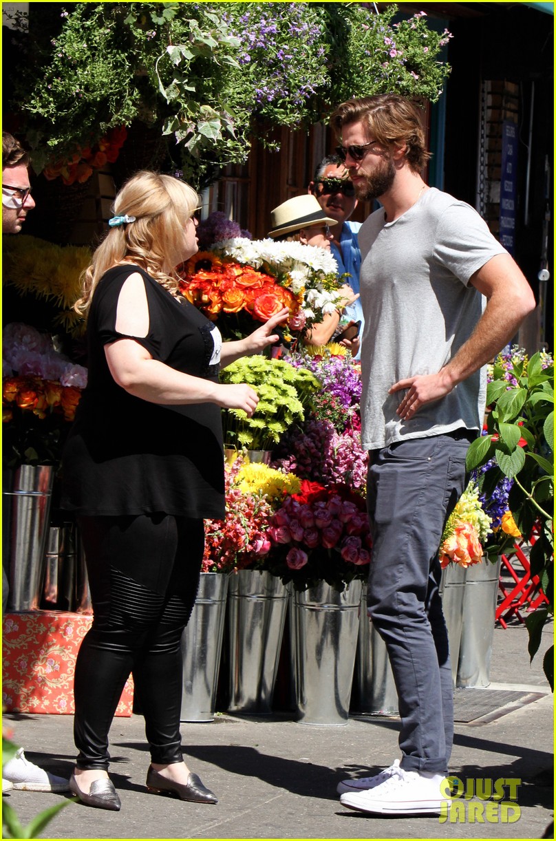 Photo: liam hemsworth has a flower for rebel wilson on isnt it romantic