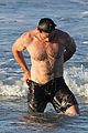 hugh jackman hits the beach with his speedo clad trainer 02