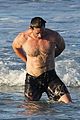 hugh jackman hits the beach with his speedo clad trainer 10