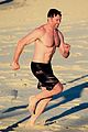 hugh jackman hits the beach with his speedo clad trainer 25