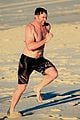 hugh jackman hits the beach with his speedo clad trainer 27