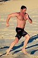 hugh jackman hits the beach with his speedo clad trainer 29