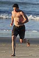 hugh jackman hits the beach with his speedo clad trainer 53