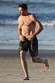 hugh jackman hits the beach with his speedo clad trainer 56