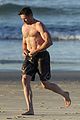 hugh jackman hits the beach with his speedo clad trainer 58