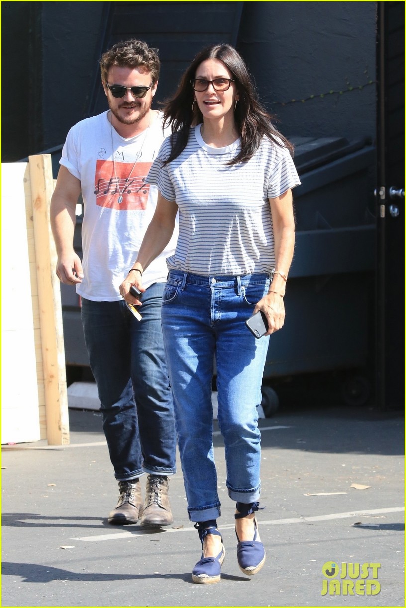 Courteney Cox Sports Denim Pants & Wedges for Furniture Shopping Trip