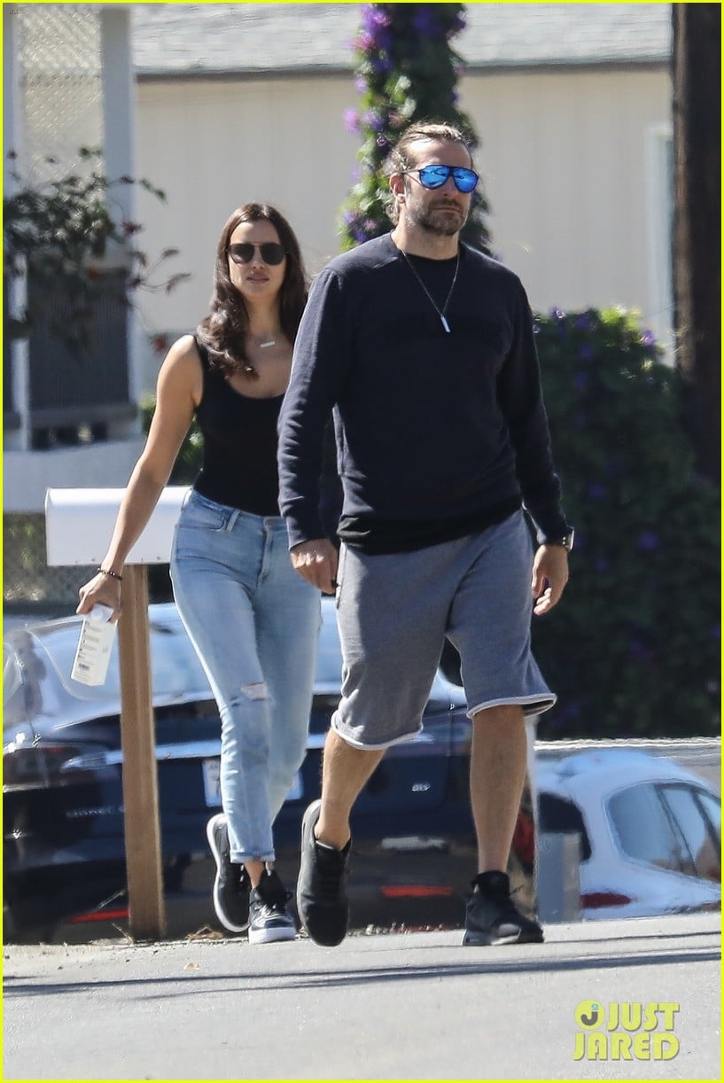Irina Shayk Playfully Grabs Bradley Cooper's Butt During Sunday Stroll...