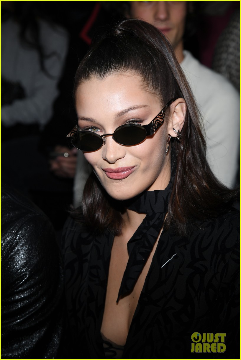 Bella Hadid looks trendy in Dior shades with a black tank top and olive  green pants