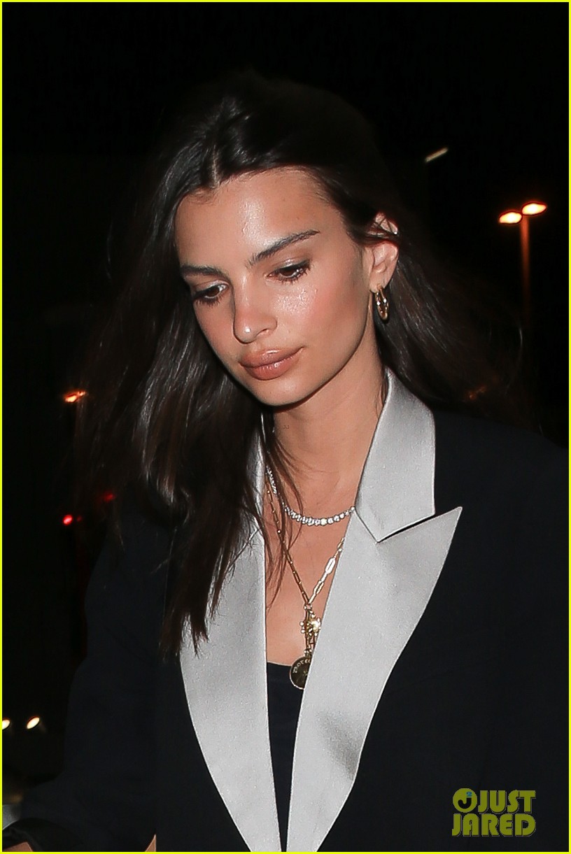 Emily Ratajkowski Brings Her Suitcase to Dinner Before a Flight: Photo