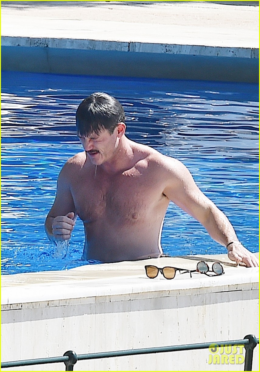 Luke Evans Shows Off His Shirtless Body In the Pool with Victor Turpin
