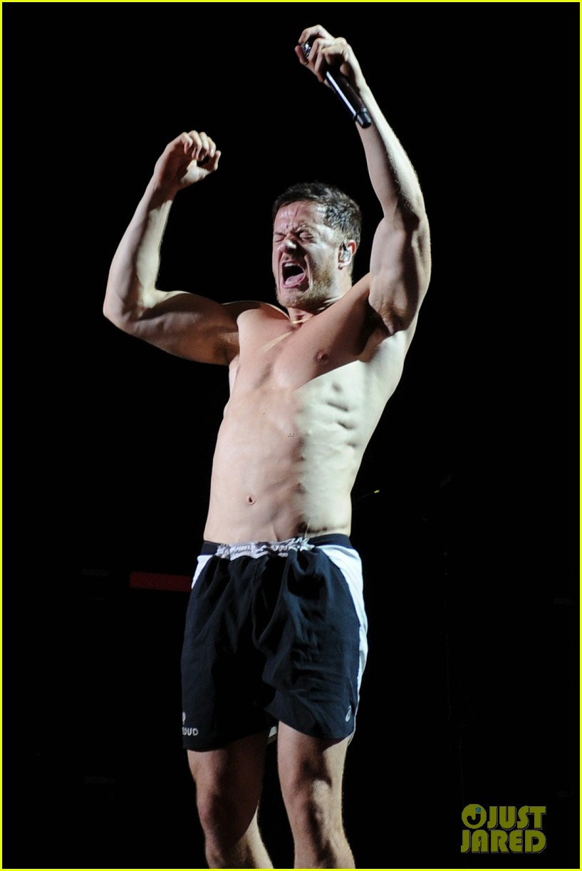 While Going Shirtless During Imagine Dragons Show dan reynolds goes shirtle...