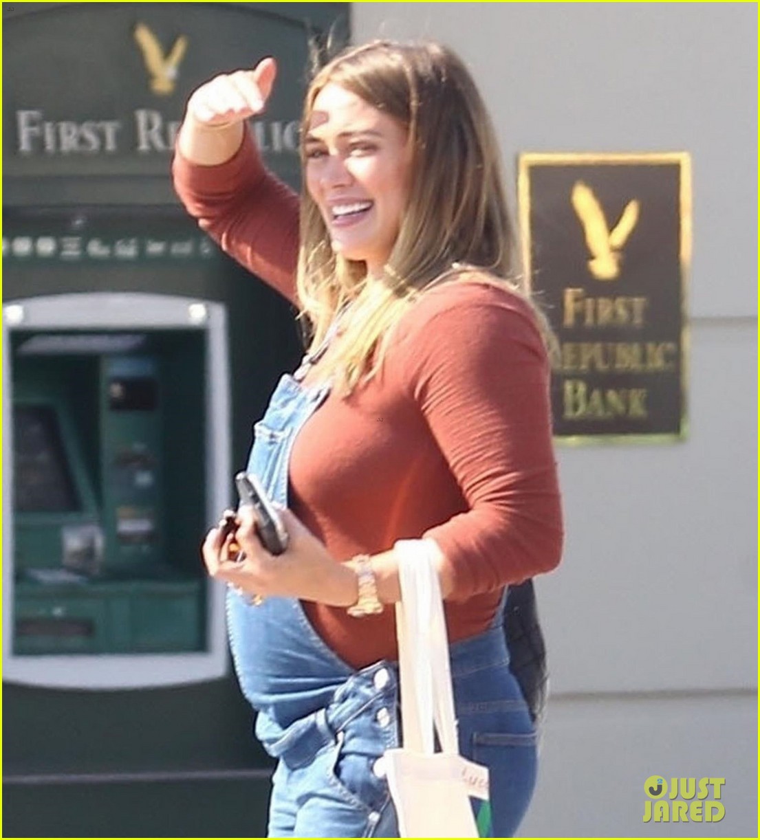 hilary duff dresses baby bump in overalls 024123882