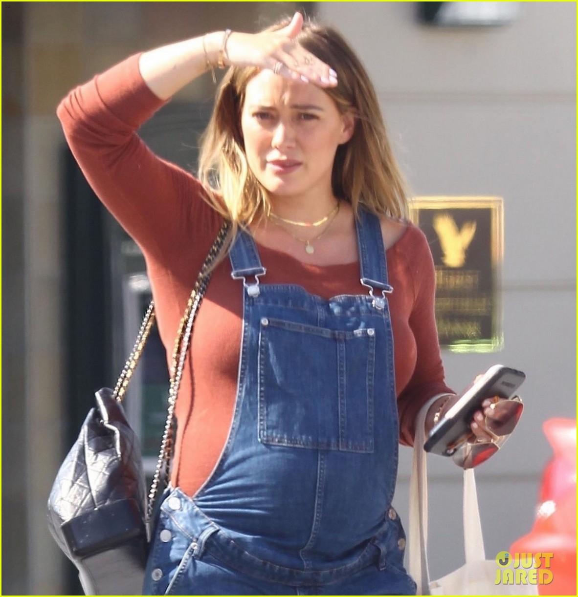 hilary duff dresses baby bump in overalls 044123884
