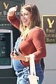 hilary duff dresses baby bump in overalls 02