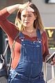 hilary duff dresses baby bump in overalls 04