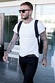 david beckham puts his tattoos on display while arriving in barcelona01