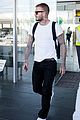 david beckham puts his tattoos on display while arriving in barcelona04