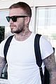 david beckham puts his tattoos on display while arriving in barcelona05