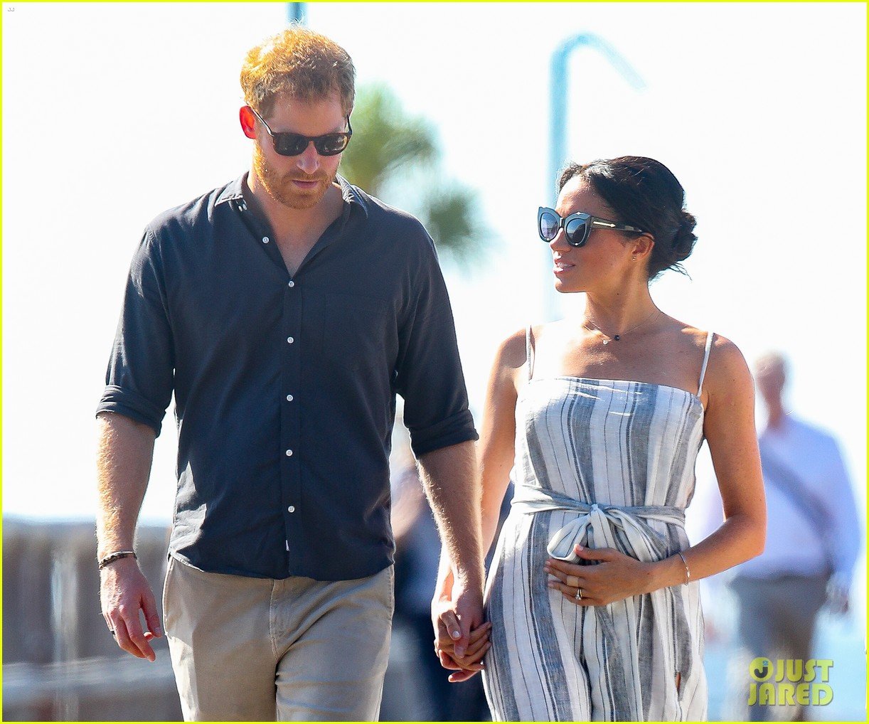 Pregnant Meghan Markle Cradles Tiny Baby Bump on Australia's Fraser