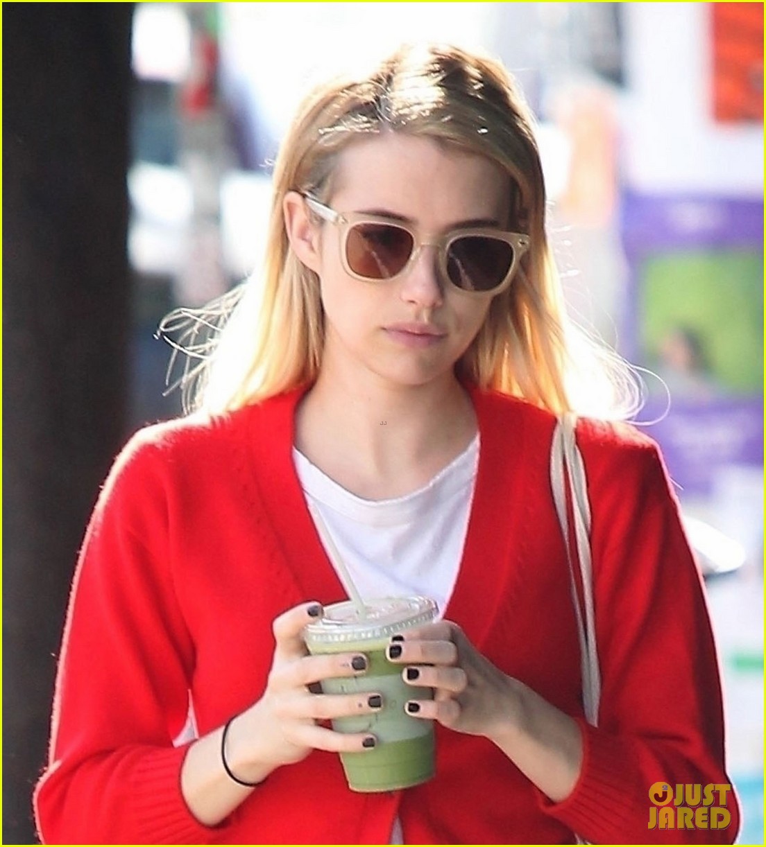 emma roberts rocks a red cardigan for her smoothie run044159436