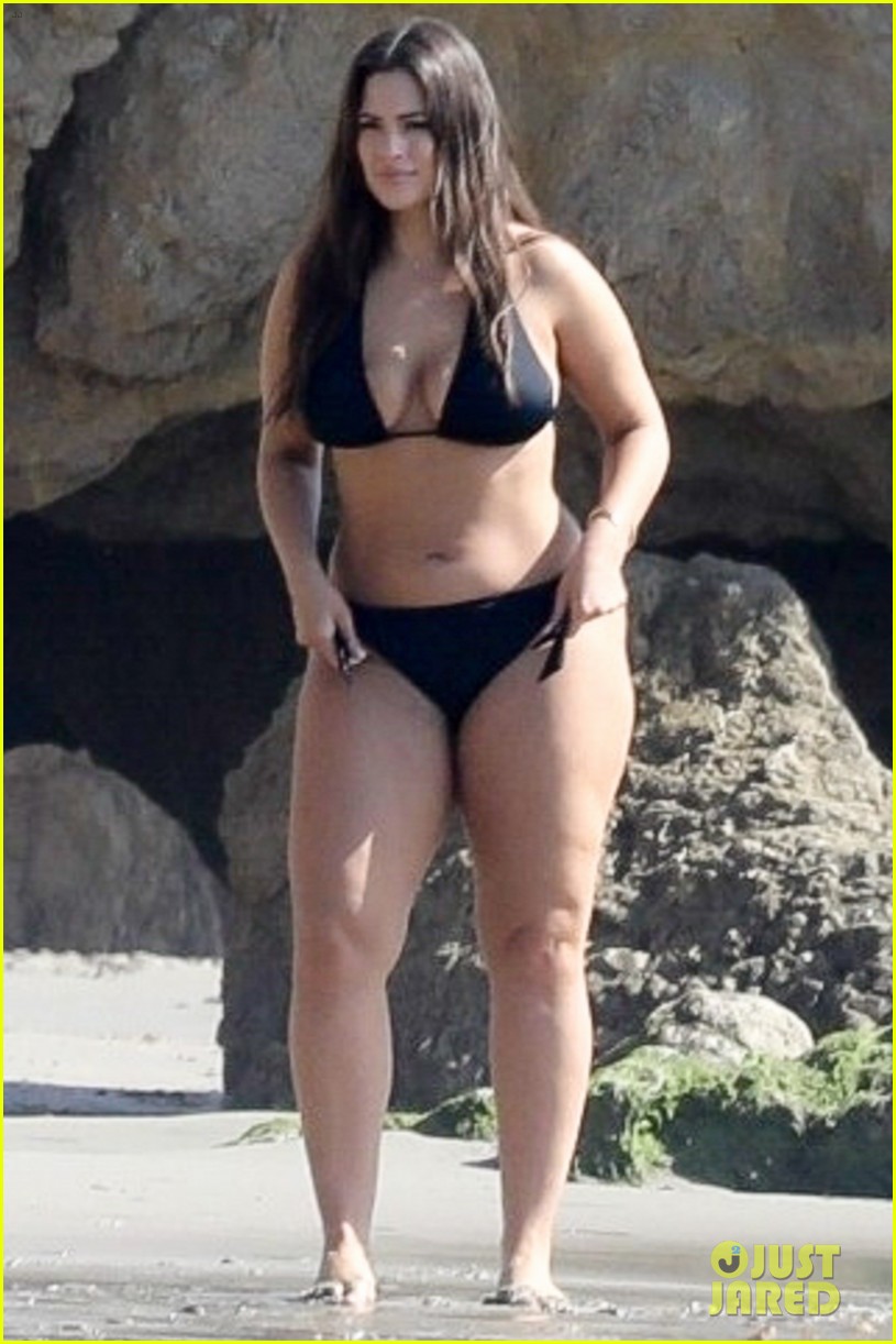 Ashley Graham shows off her body in a bikini while posing for a photo shoot...