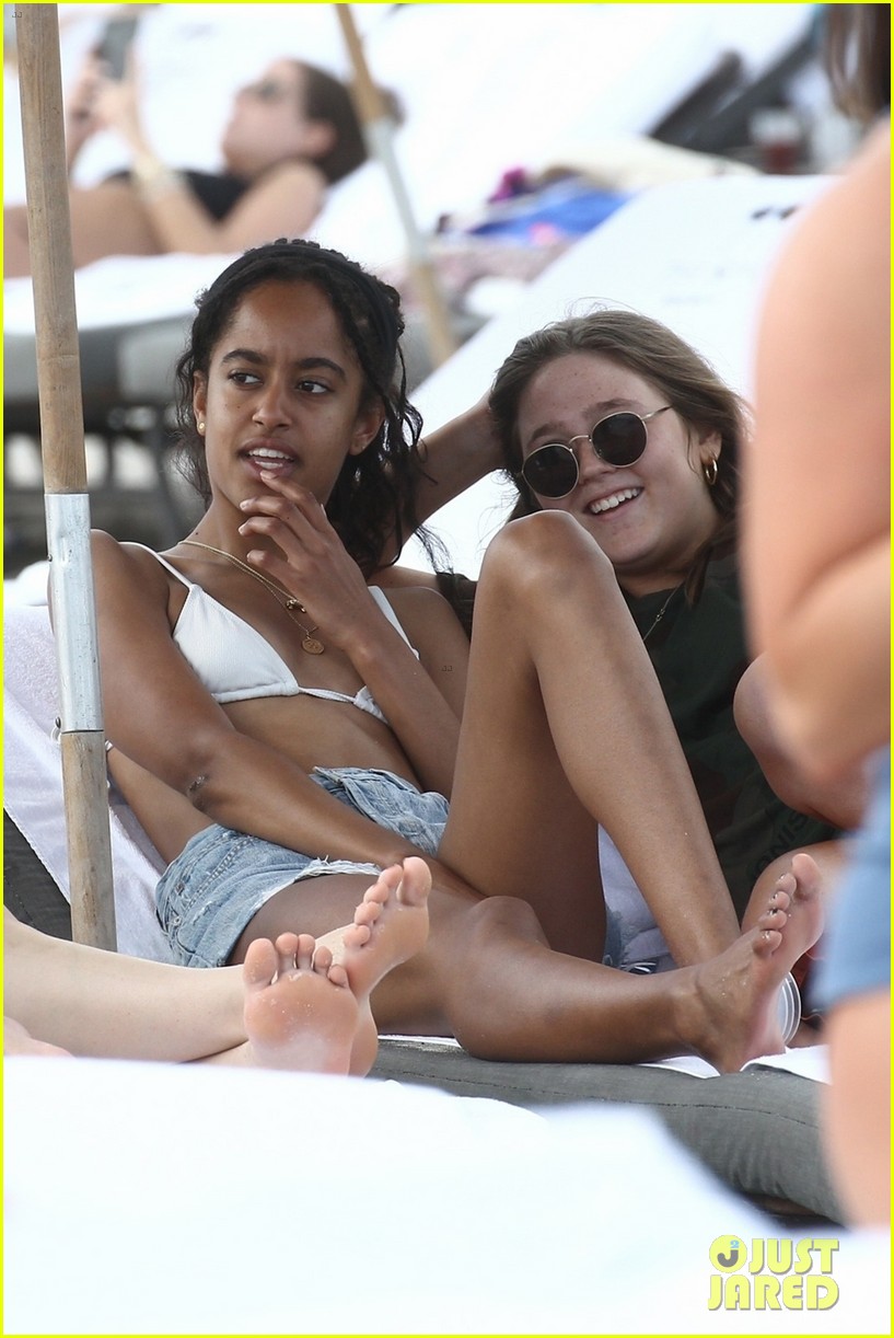 Malia Obama lounges around the beach in a bikini while vacationing with fri...