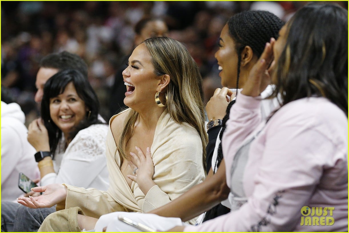 Chrissy Teigen Reacts Immediately After Dwyane Wade Crashes Into Her in