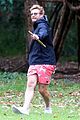 simon baker plays fetch with his dog in sydney 01