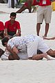 jamie dornan wrestling on the beach 03
