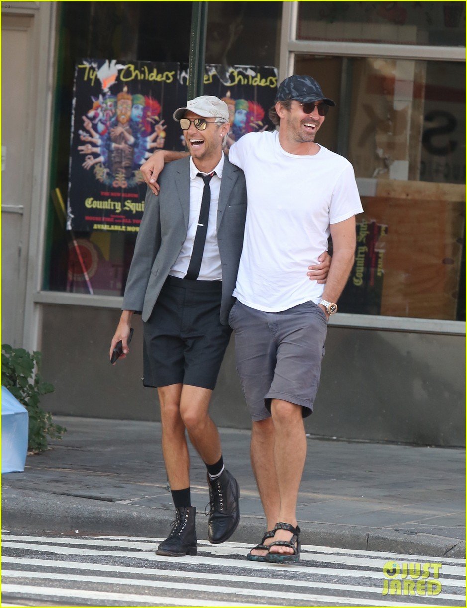 Lee Pace wraps his arm around boyfriend Matthew Foley while going for a str...