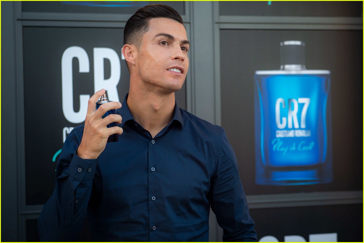 Cristiano Ronaldo kisses the new CR7 Play It Cool fragrance at the launch p...