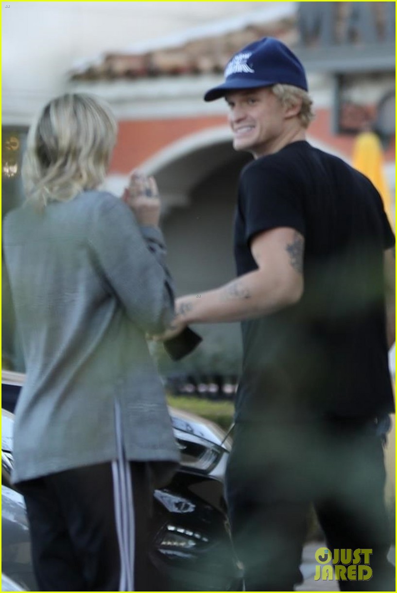 Miley Cyrus & Boyfriend Cody Simpson Keep Close on Dinner Date Photo