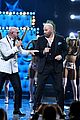 john travolta teams up with pitbull for live performance at univisions premio lo nuestro 2020 02