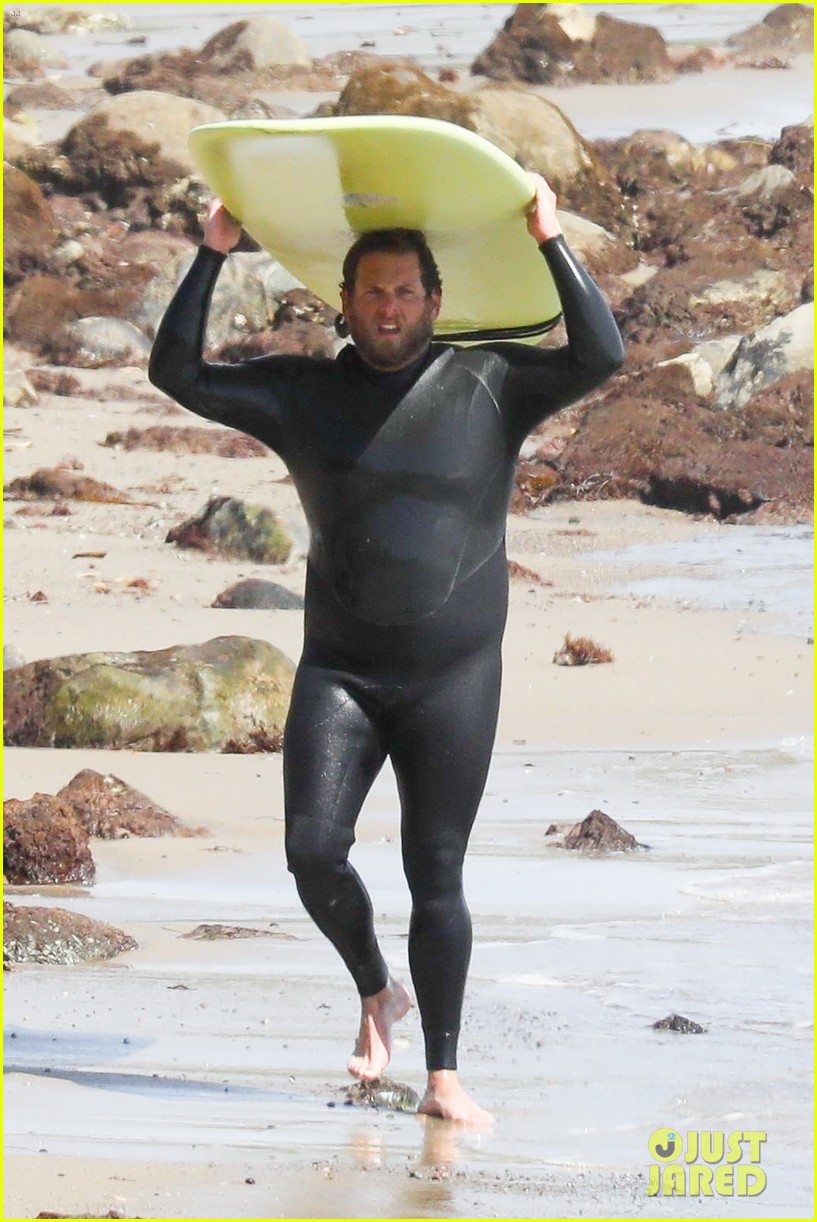 Jonah Hill Shows Off Tattoos While Stripping Out of Wetsuit Photo
