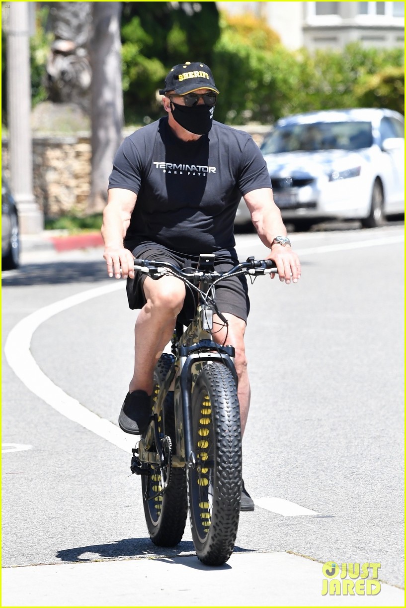 arnold schwarzenegger riding a bike